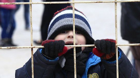 This child at the Turkish borderon near Kilis is among 11 million Syrians who have been forced to flee their homes.