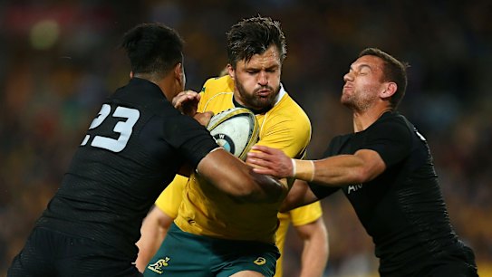 Going nowhere: Adam Ashley-Cooper runs into traffic in Sydney.