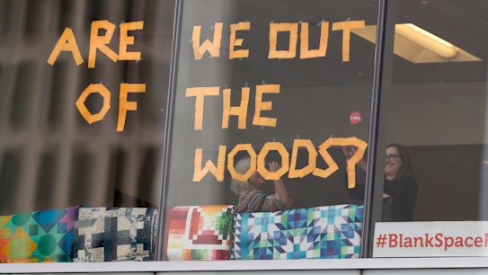 Workers in support of pop singer Taylor Swift in office across from the federal courthouse put up a new sign as the jury gets the case in the civil trial involving the singer in a case in federal court Monday, August 14, 2017, in Denver.