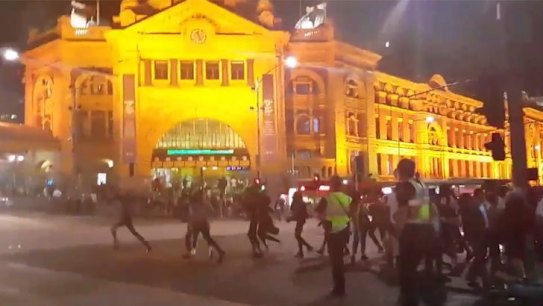 Apex gang rioters in Melbourne CBD, outside Flinders Street Station.