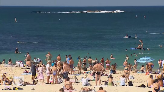 Sydney's beaches were swamped on the eve of COVID-19 restrictions easing but the NSW Premier warns the state must stay the course.