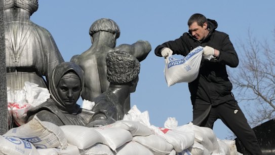 A city resident covers the monument to Taras Shevchenko, a famous Ukrainian poet and a national symbol, with sandbags to protect from the Russian shelling, in Kharkiv. The bronze 16-metre monument was opened in 1935, survived WWII and is considered one of the world's best monuments to Shevchenko.