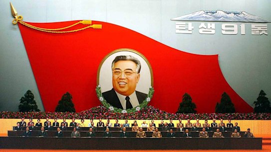 A huge flag-shaped painting featuring Kim Il-sung at an annual meeting to mark the late leader's birthday in North Korea.