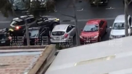 A man who breached Melbourne’s stage four restrictions has been charged after a police officer was thrown off a car in Melbourne’s inner south-east.
