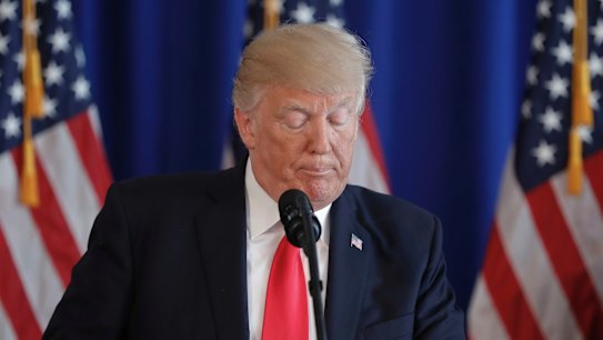Donald Trump pauses while speaking about the violence in Charlottesville. 