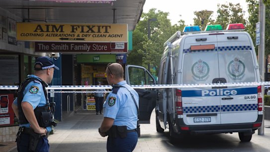 Police at the scene where Ho Ledinh was shot dead in Bankstown on Tuesday.
