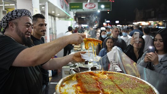 Muslims break their daily fast during the month of Ramadan by visiting food stalls in the evening along Haldon Street, Lakemba.