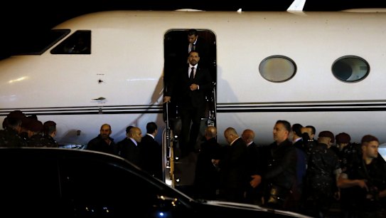Lebanese Prime Minister Saad Hariri disembarks upon arriving at the Rafik Hariri International Airport in Beirut.