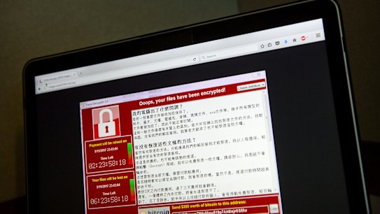 A screenshot of the warning screen from a purported ransomware attack, as captured by a computer user in Taiwan, is seen on laptop in Beijing.