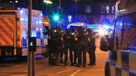 Armed police gather at Manchester Arena after reports of an explosion at the venue during an Ariana Grande gig in Manchester.