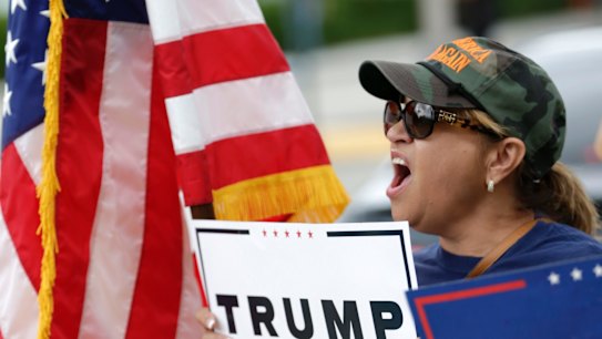 Angry and mobilised - but to where? Donald Trump supporter outside a rally for Democratic presidential candidate Hillary Clinton in Miami. 