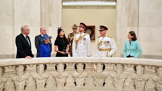 Britain's Prince Harry, center, and his wife Meghan, center left, the Duchess of Sussex and Governor of New South Wales David Hurley view the Hall of Memory at the official opening of Anzac Memorial at Hyde Park in Sydney, Australia, Saturday, Oct. 20, 2018. Prince Harry and his wife Meghan, Duchess of Sussex, are on a 16-day tour to Australia and the South Pacific. (Joel Carrett/Pool Photo via AP)