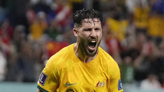 Australia's Mathew Leckie celebrates after scoring his side's first goal during the World Cup group D soccer match between Australia and Denmark, at the Al Janoub Stadium in Al Wakrah, Qatar, Wednesday, Nov. 30, 2022. (AP Photo/Thanassis Stavrakis)