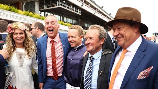 Winning combination: Kerrin McEvoy celebrates with connections after he rode Almandin to win the Melbourne Cup.