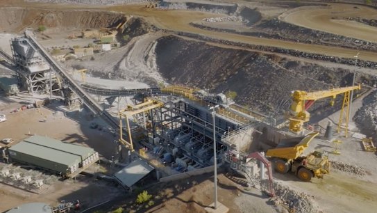 The boss of Mineral Resources will step down after a tax probe into the Western Australian mining company.