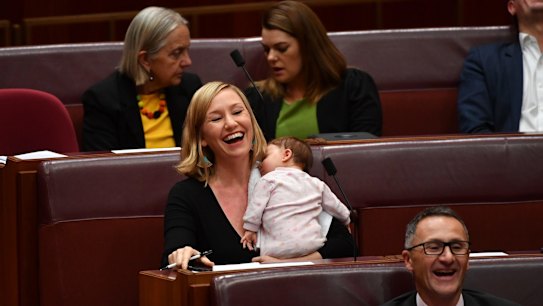 Greens co-deputy leader Larissa Waters soothes baby Alia Joy after breastfeeding her in the Senate.
