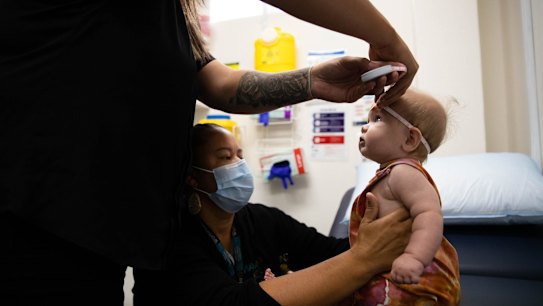 Mel Briggs and Georgie Resch perform baby checks at Waminda.