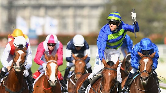  Nicholas Hall riding Jameka celebrates winning the 2016 Caulfield Cup on Saturday.