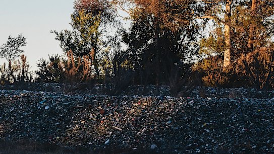 The piles of glass from ACT recycling bins dumped near the Federal Highway at Lake George.