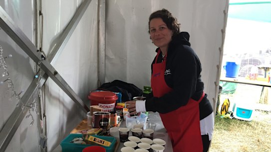 Salvation Army volunteer Kylie Smith making free coffee for people at Falls on Saturday.
