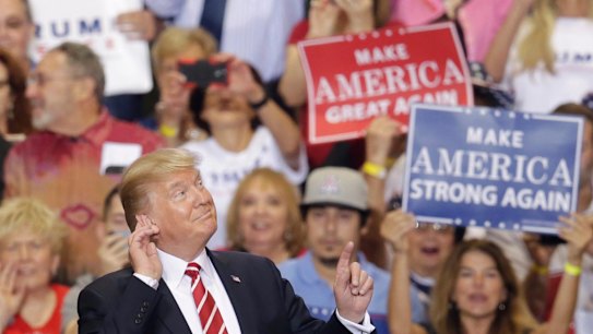 As the rally dragged on into the night, many in the crowd lost interest in what the President was saying.