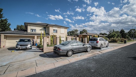 Police officers and froensic staff attend the scene of an overnight shooting and arson attack in Harrington circuit, Kambah. Three bullets have hit the home and two vehicles have been set alight.  Photo by Karleen Minney.