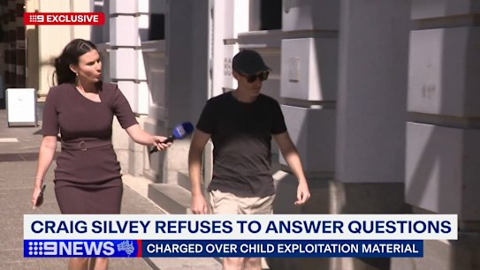Australian author Craig Silvey has been filmed reporting to police as part of his bail conditions.