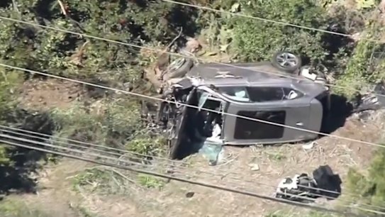 Tiger Woods has been hospitalised after his car rolled in a serious crash in LA.