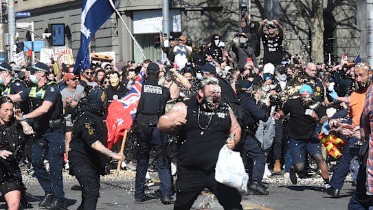 Protesters coated in capsicum spray outsider state parliament on Spring Street in Melbourne’s CBD.