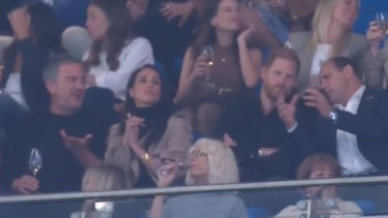 Prince Harry and Meghan, Duchess of Sussex, are spotted in the stands at Allianz Stadium.