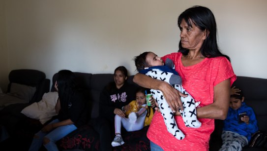 Lee-Anne Ebsworth with her grandson, Gordon, in the public housing home of her mother in Dubbo. Her family lived in the Gordon Estate during the 2006 riots and were forced to move afterwards when the government bulldozed dozens of homes and sold others. Since then her family is scattered over Dubbo, and  Lee-Anne remains homeless after being denied another public housing home. She spends her time staying with relatives. 9th May 2019 Photo: Janie Barrett