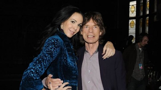 Tragic ... Designer L'Wren Scott and boyfriend musician Mick Jagger pose at the L'Wren Scott Fall 2012 fashion show during Fashion Week in New York City.