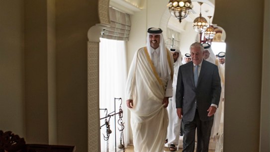 The Emir of Qatar, Sheikh Tamim Bin Hamad Al Thani, left, welcomes US Secretary of State Rex Tillerson to Sea Palace, his official residence, in Doha on Tuesday.