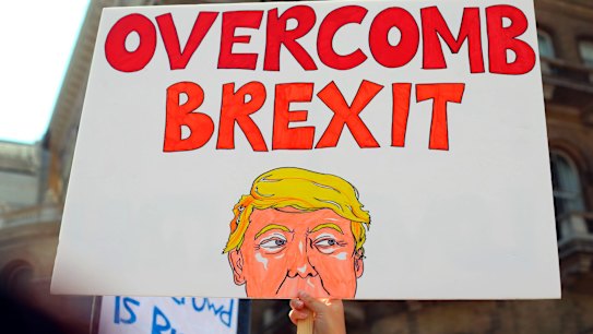 Protesters for the 'Stop Trump' Women's March gather in London, Friday, July 13, 2018. 