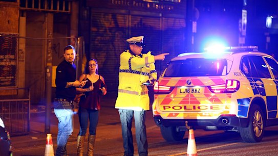 Police cordon off streets near Manchester Arena. 