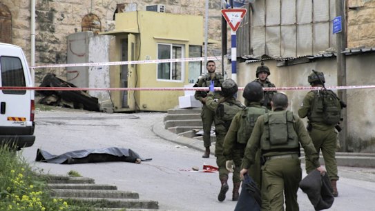 Israeli soldiers near the body of Abdel Fattah Sharif, who was shot and killed by Sergeant Elor Azaria in March. 