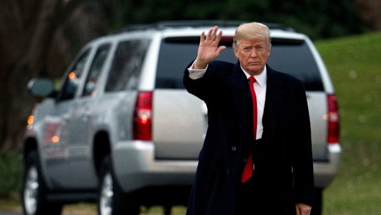 US President Donald Trump waves as he leaves the White House on Friday.