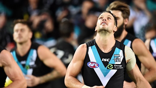Boak leads his team onto the ground against Geelong.