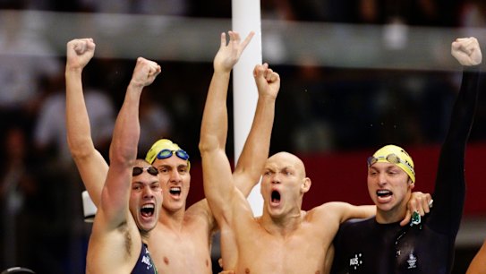 The Australian team (l to r) Michael Klim , Ian Thorpe, Chris Fydler and Ashley Callus, celebrate winning gold medal in the en's 4x100m relay in record time.