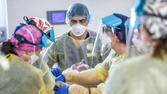 ICU nurses at work on a patient. at work on a patient. 