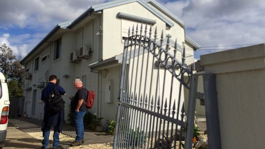 AFP officers outside Richard Vong's house in the Melbourne suburb of Thomastown, which was raided on Wednesday.
