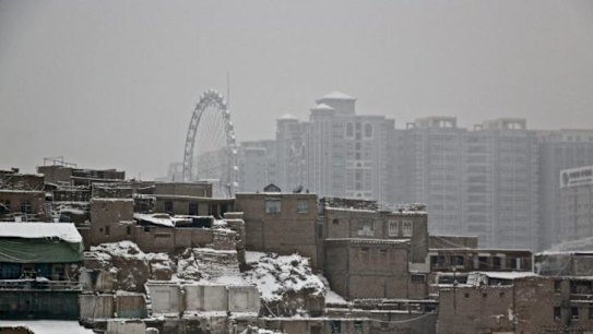 'Assimilation on steroids': Kashgar's old town (foreground) make's way for high-rises as part of China's policy to make the town a special economic zone.
