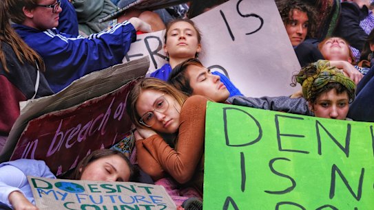 Protesters take part in the Climate Emergency XR Snap Rally in Melbourne.