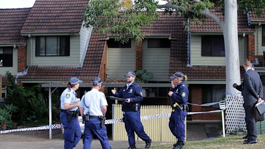 Police at a home on Florida Street in Sylvania where a woman was found dead.