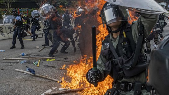 Protesters clash with police officers in Kowloon Bay in Hong Kong, Aug. 24, 2019. 
