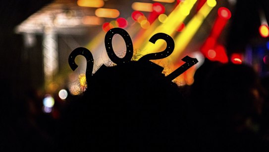 Katrina Mohi watches bands in Hagley Park in Christchurch, New Zealand during New Year celebrations.