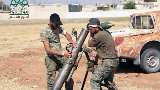 Rebel fighters from Ahrar al-Sham prepare an attack on Islamic State in Aleppo.