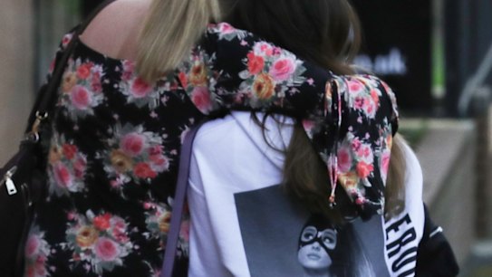 Ariana Grande concert attendees Karen Moore and her daughter Molly Steed, aged 14, from Derby, leave the Park Inn where they were given refuge.