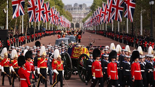 LONDON, ENGLAND - SEPTEMBER 19: The Queen's funeral cortege borne on the State Gun Carriage of the Royal Navy travels along The Mall on September 19, 2022 in London, England. Elizabeth Alexandra Mary Windsor was born in Bruton Street, Mayfair, London on 21 April 1926. She married Prince Philip in 1947 and ascended the throne of the United Kingdom and Commonwealth on 6 February 1952 after the death of her Father, King George VI. Queen Elizabeth II died at Balmoral Castle in Scotland on September 8, 2022, and is succeeded by her eldest son, King Charles III.  (Photo by Dan Kitwood/Getty Images)