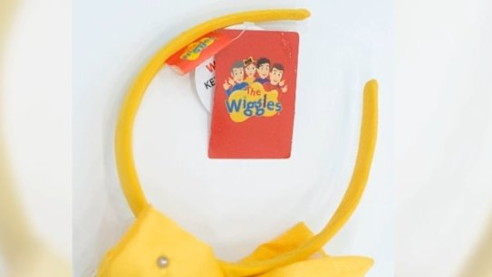 The company behind The Wiggles has admitted it likely breached consumer law by selling Emma Bow headbands without the mandatory safety warnings required for products containing button batteries.